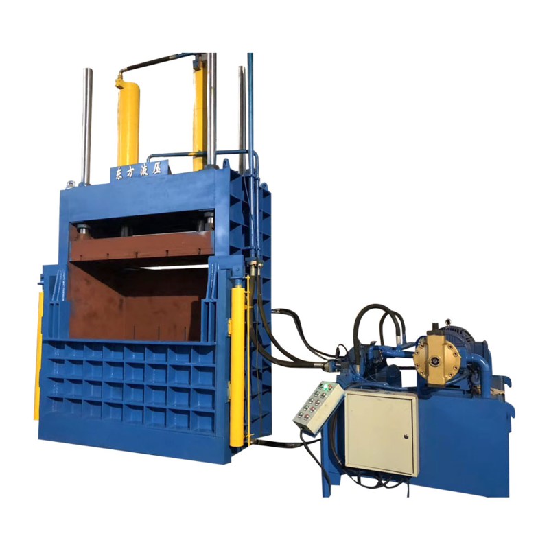 Industrial baling machine processing heavy scrap metals